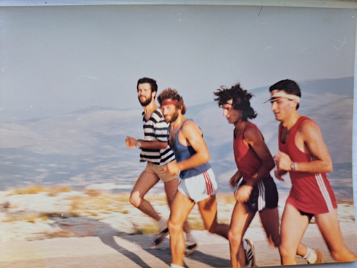 A group of men running

Description automatically generated