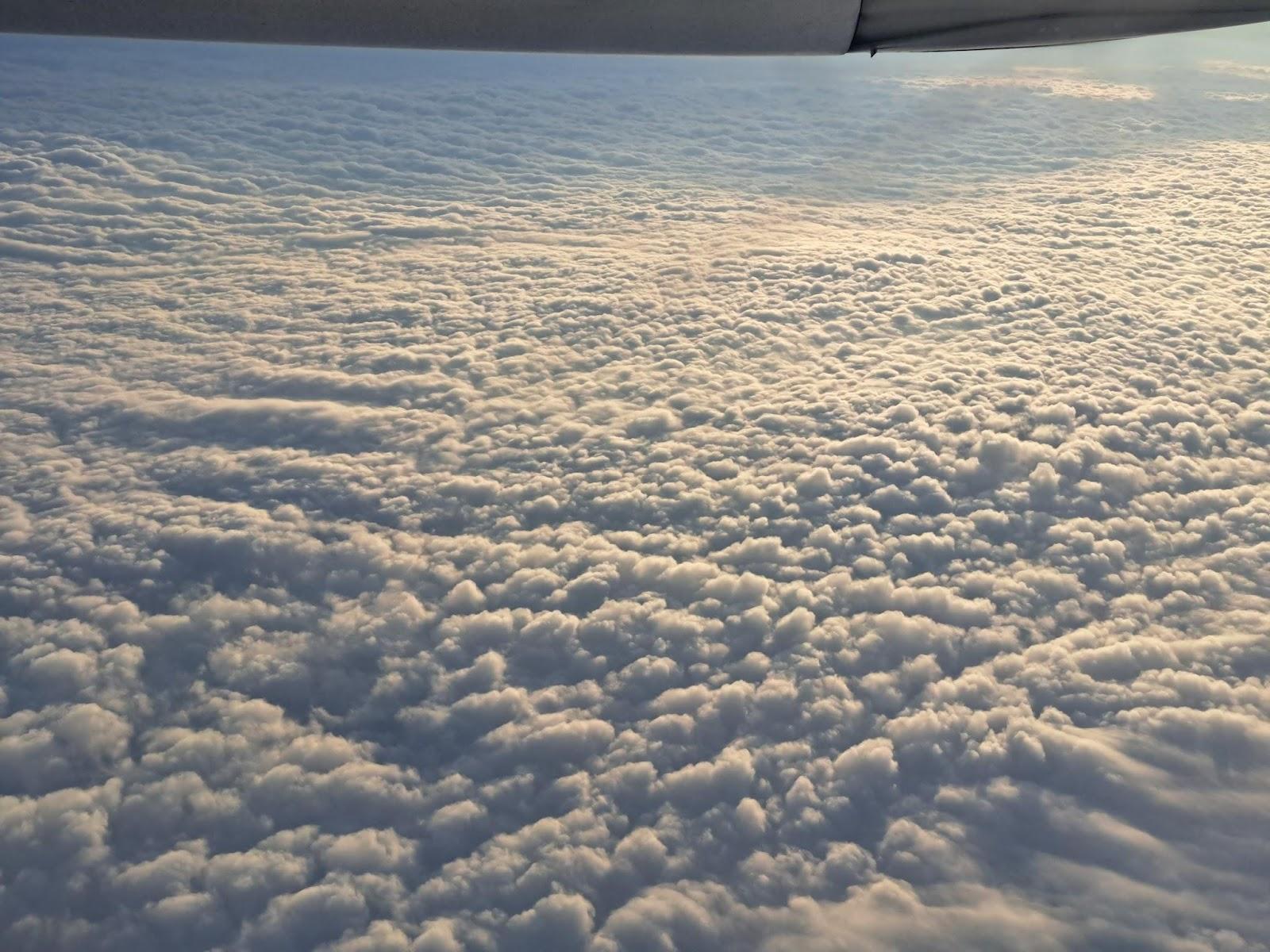 Clouds and clouds from an airplane

Description automatically generated
