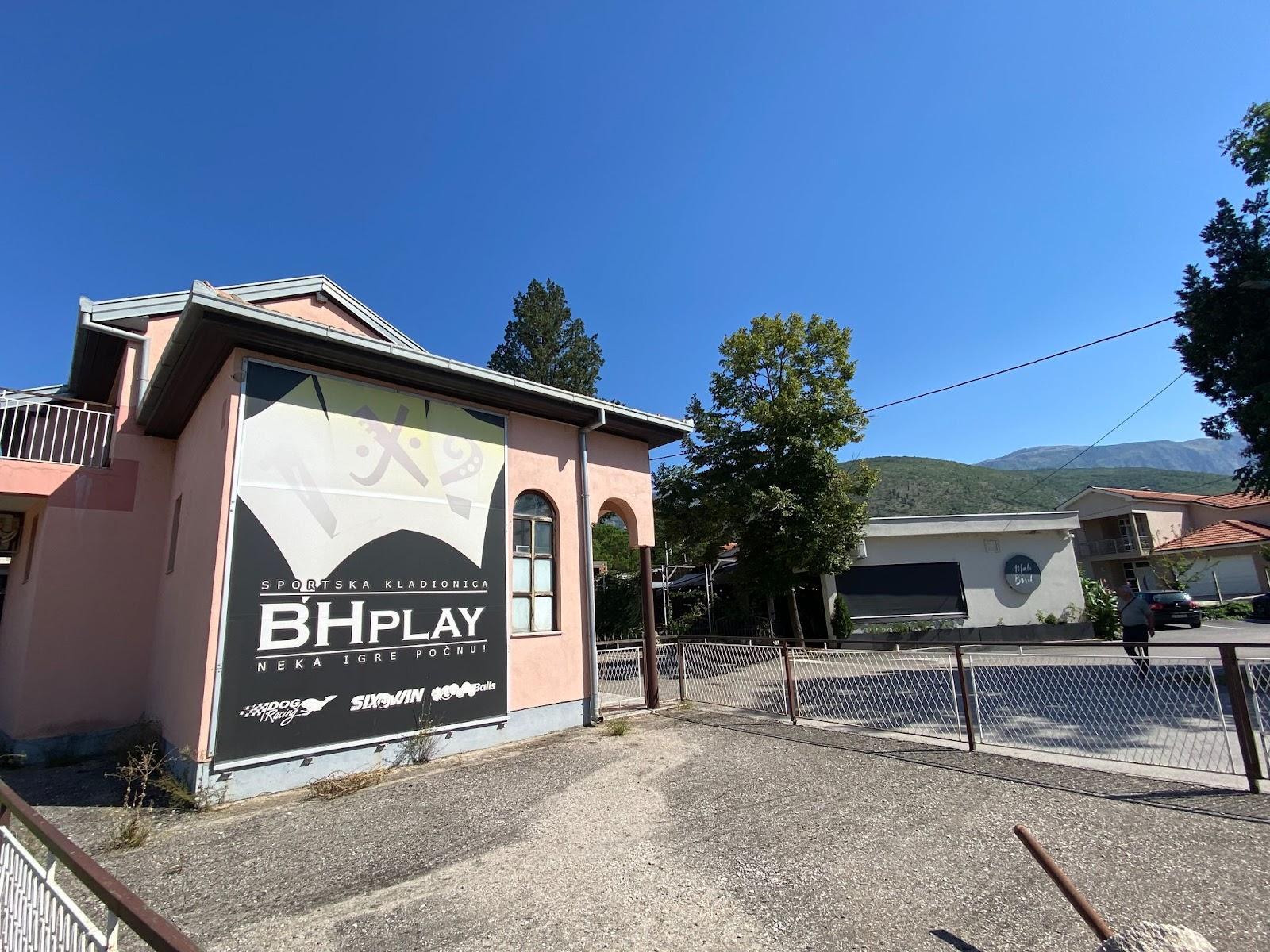 A building with a sign on it

Description automatically generated